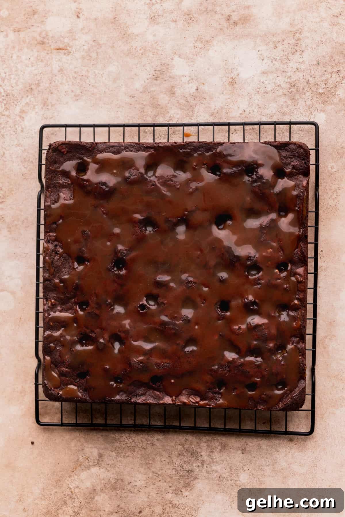 Caramel on top of the holes on the brownies.