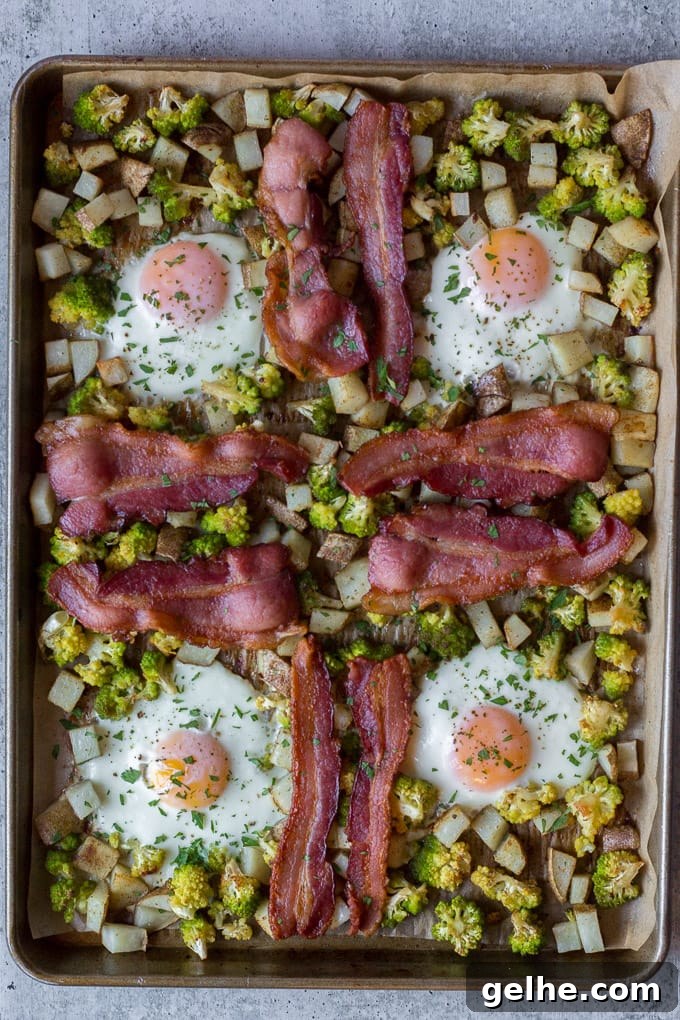 Whole30 Sheet Pan Breakfast Bake for Busy Mornings 8 top down view of cooked easy sheet pan breakfast with eggs, bacon, potatoes, and romanesco
