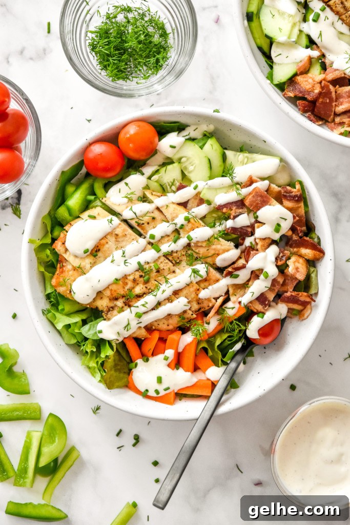 Chicken Bacon Ranch Salad Recipe: Creamy, Crunchy Weeknight Favorite 2 go-to chicken bacon ranch salad with fresh herbs in a white dinner bowl.