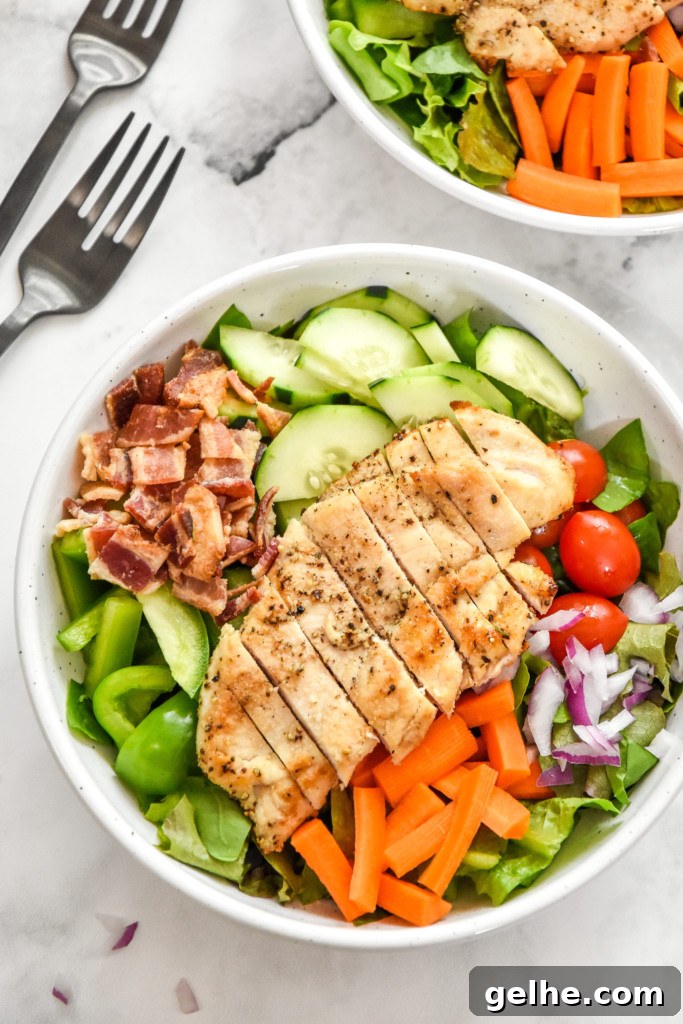 Chicken Bacon Ranch Salad Recipe: Creamy, Crunchy Weeknight Favorite 9 a prepped chicken bacon ranch salad in a bowl without dressing.