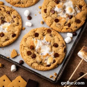 S'more chocolate chip cookies laying on a baking sheet.