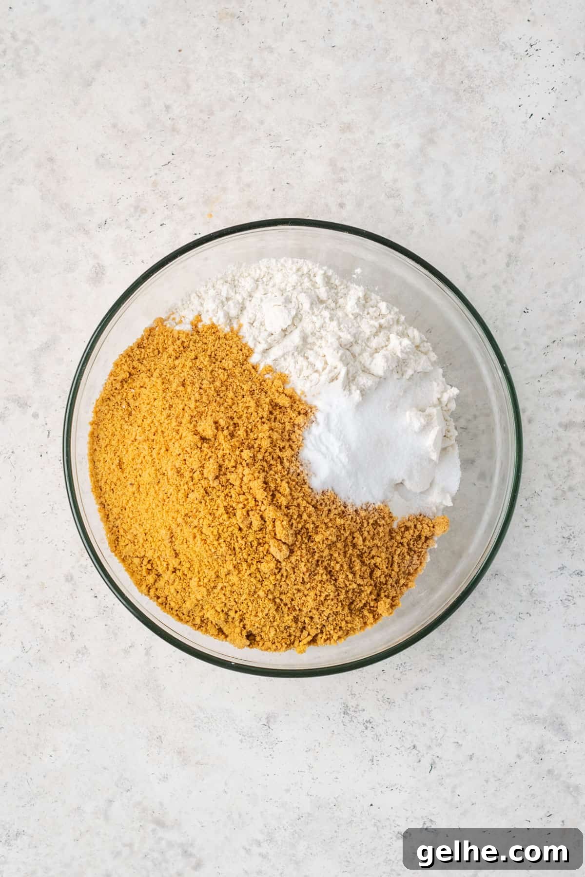 Gluten free flour, graham cracker crumbs, baking soda and salt combined in a small mixing bowl.