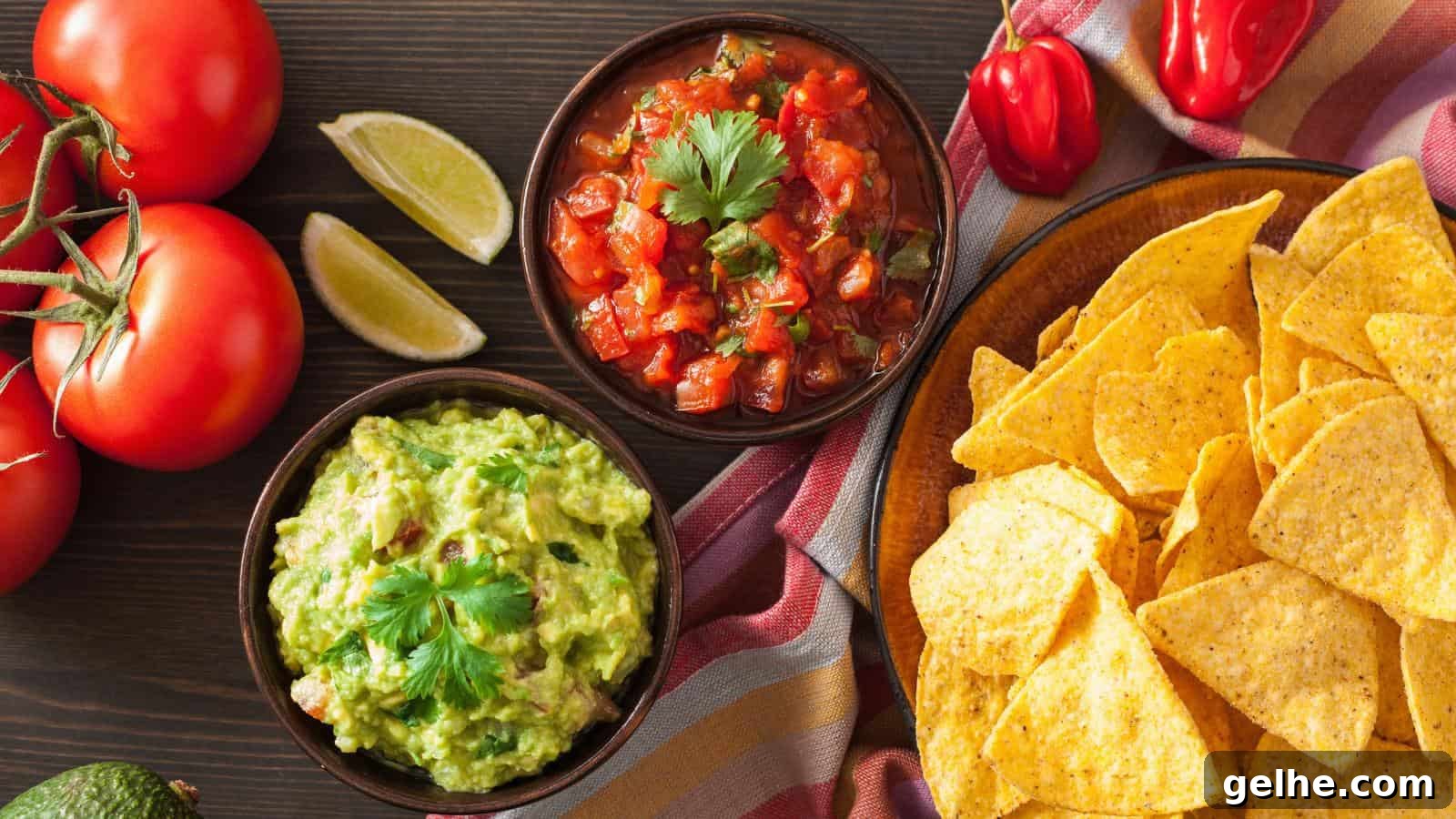 21 Labor Day Picnic Recipes for a Crowd: Ultimate Menu Ideas 23 A bowl of guacamole garnished with cilantro and an upright tortilla chip.