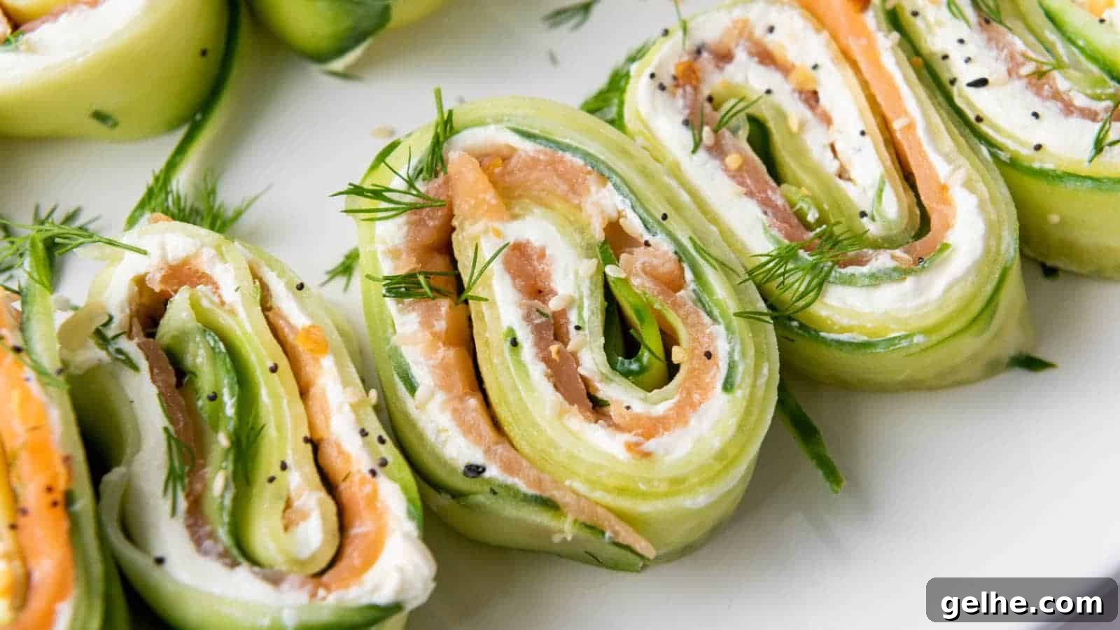 21 Labor Day Picnic Recipes for a Crowd: Ultimate Menu Ideas 10 Slices of cucumber appetizers filled with cream cheese, smoked salmon, and dill, garnished with additional dill.