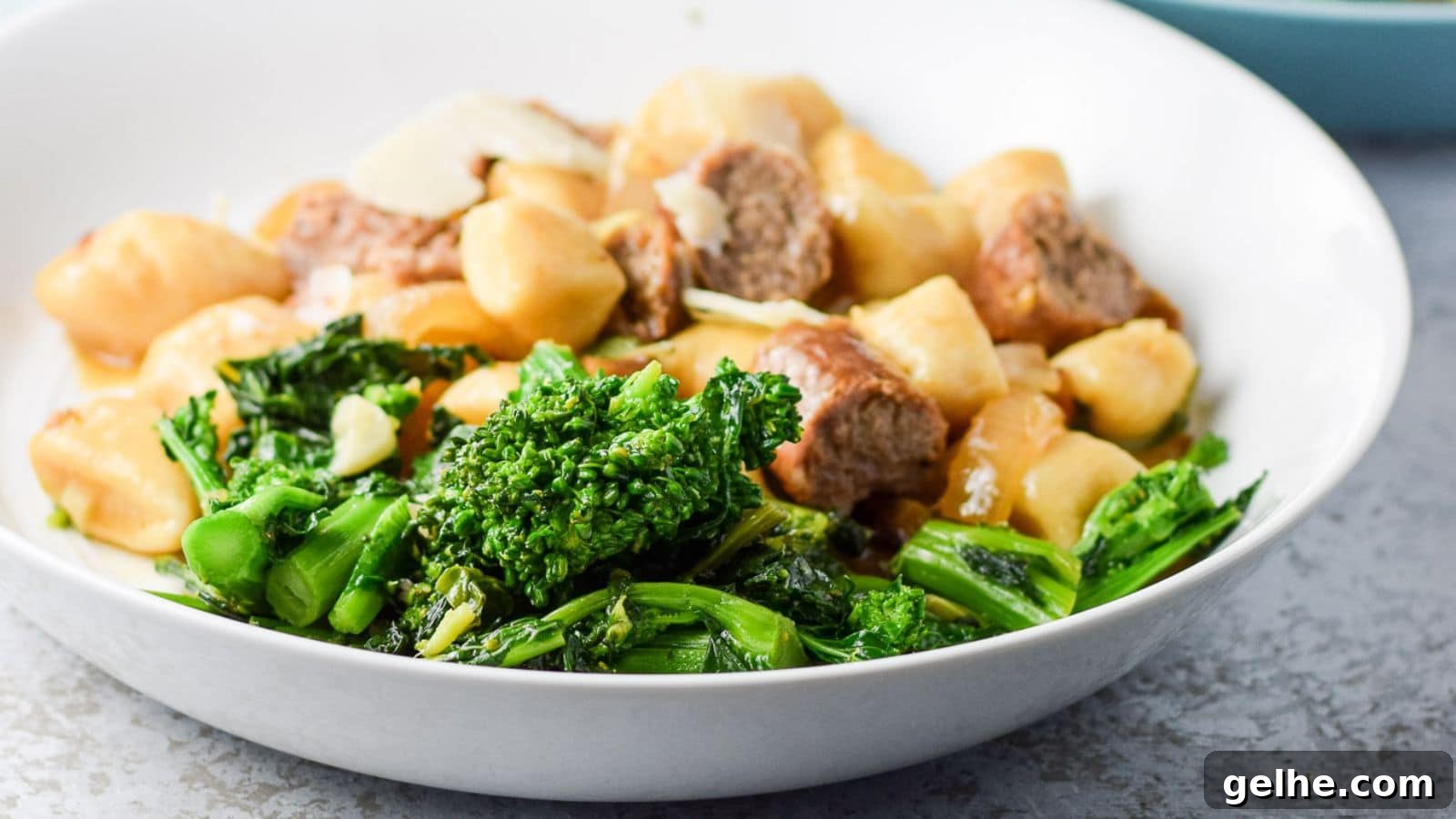 a deep plate with the broccoli rabe with gnocchi and sausage