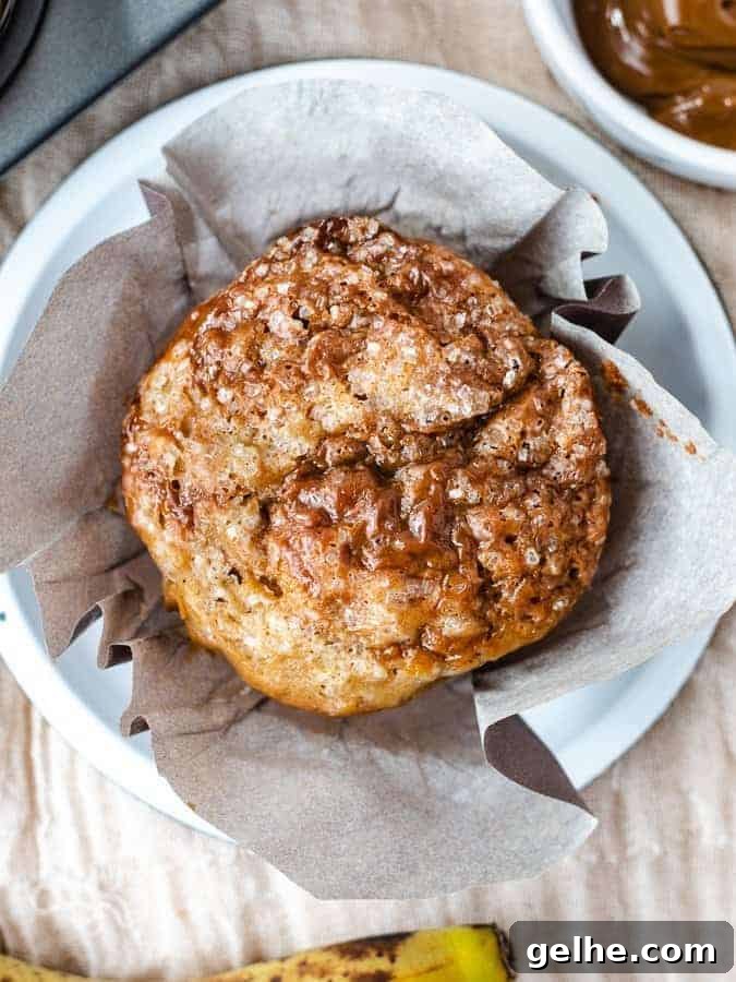 Overhead shot of single banana dulce de leche muffin with wrapper opened