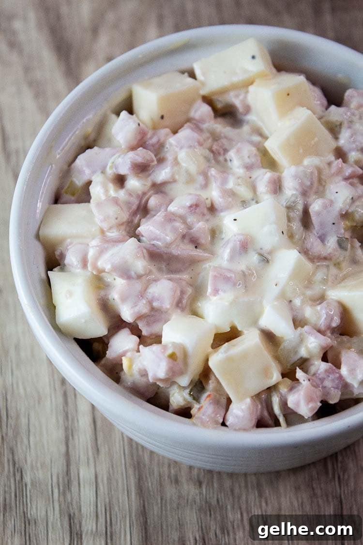 overhead view of ham salad ready to serve in a white bowl
