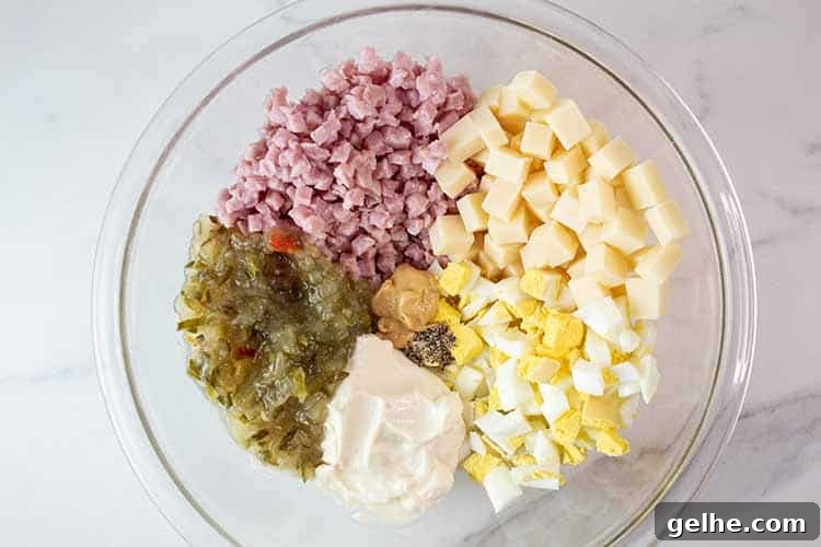 overhead view of each ingredient in a glass mixing bowl ready to be combined