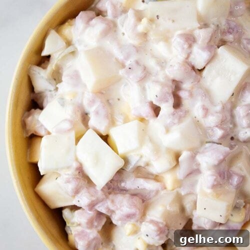 overhead view of ham salad ready to serve in a yellow bowl