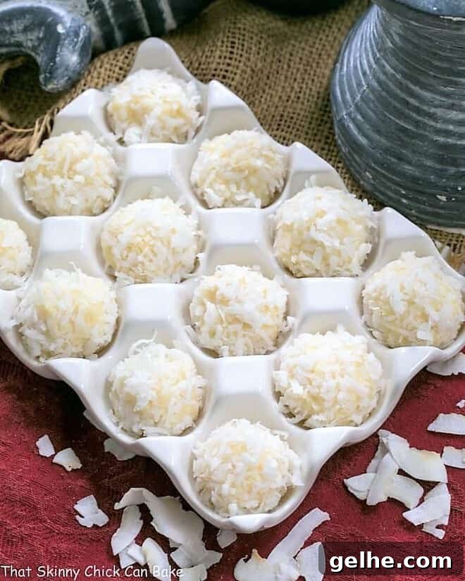 Coconut White Chocolate Truffles in a ceramic egg crate.