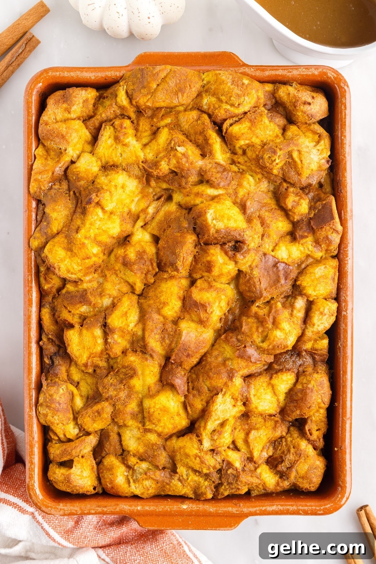 Baked bread pudding in a baking dish.