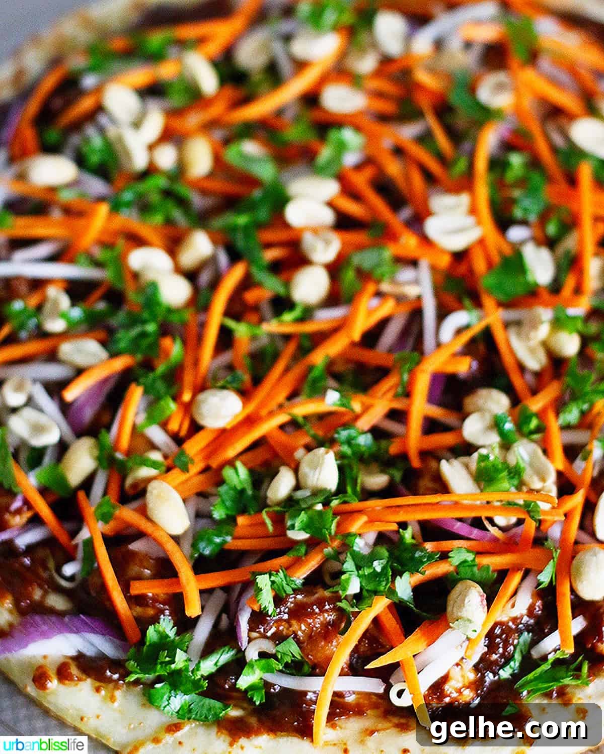 CPK Thai Chicken Pizza Copycat Recipe: Creamy Peanut & Sweet Chili 3 CPK Thai Chicken Pizza with carrots, peanuts, cilantro, chicken.