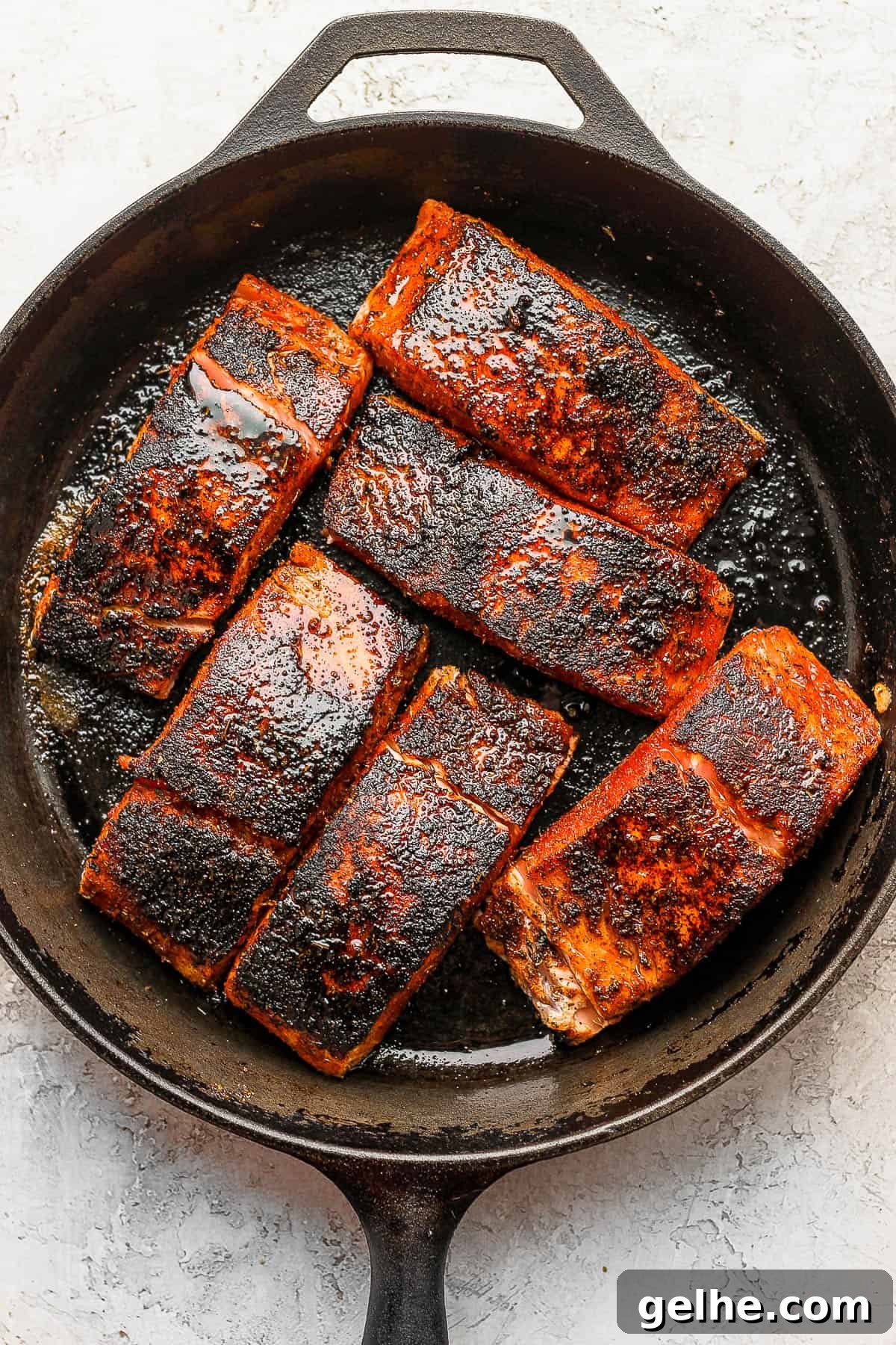 Savory Blackened Seasoning Blend for Fish, Chicken & Vegetables 5 Blackened salmon in a cast iron skillet.