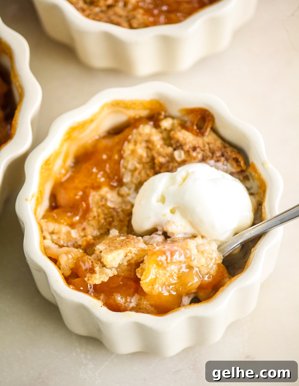 Mini Peach Cobbler Recipe: Quick Southern-Style Dessert 2 Individual cobblers with jammy peaches and a tender biscuity topping