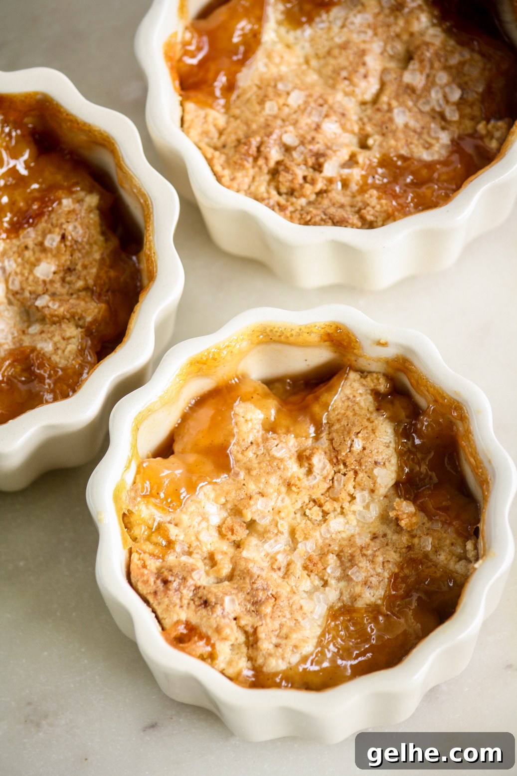 Mini Peach Cobbler Recipe: Quick Southern-Style Dessert 4 Individual cobblers with jammy peaches and a tender biscuity topping