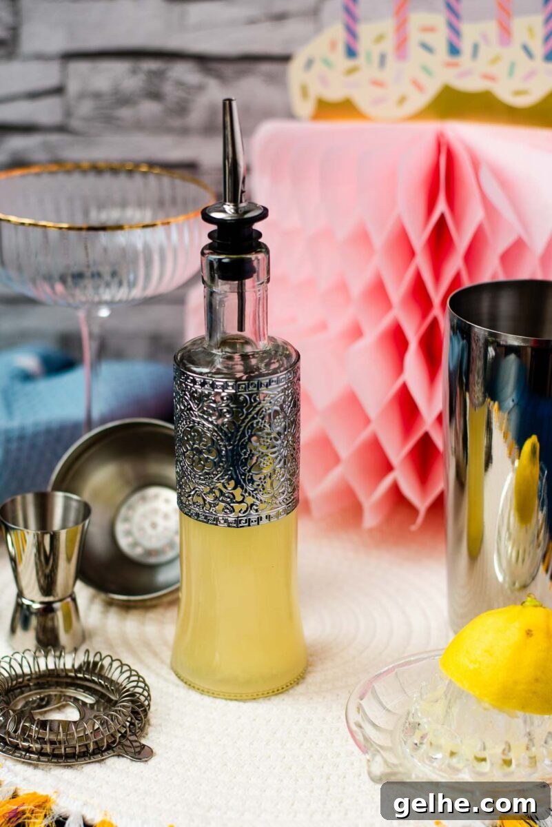 Fresh-Squeezed Lemon Juice: A Complete Guide to Making and Using It 3 Bottle filled with freshly squeezed lemon juice fitted with a pouring spout, surrounded by cocktail making tools.