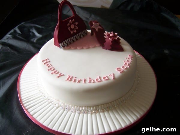 sugar handbag and shoe cake 1 tier white cake with maroon handbag and sugar shoe decorations on top