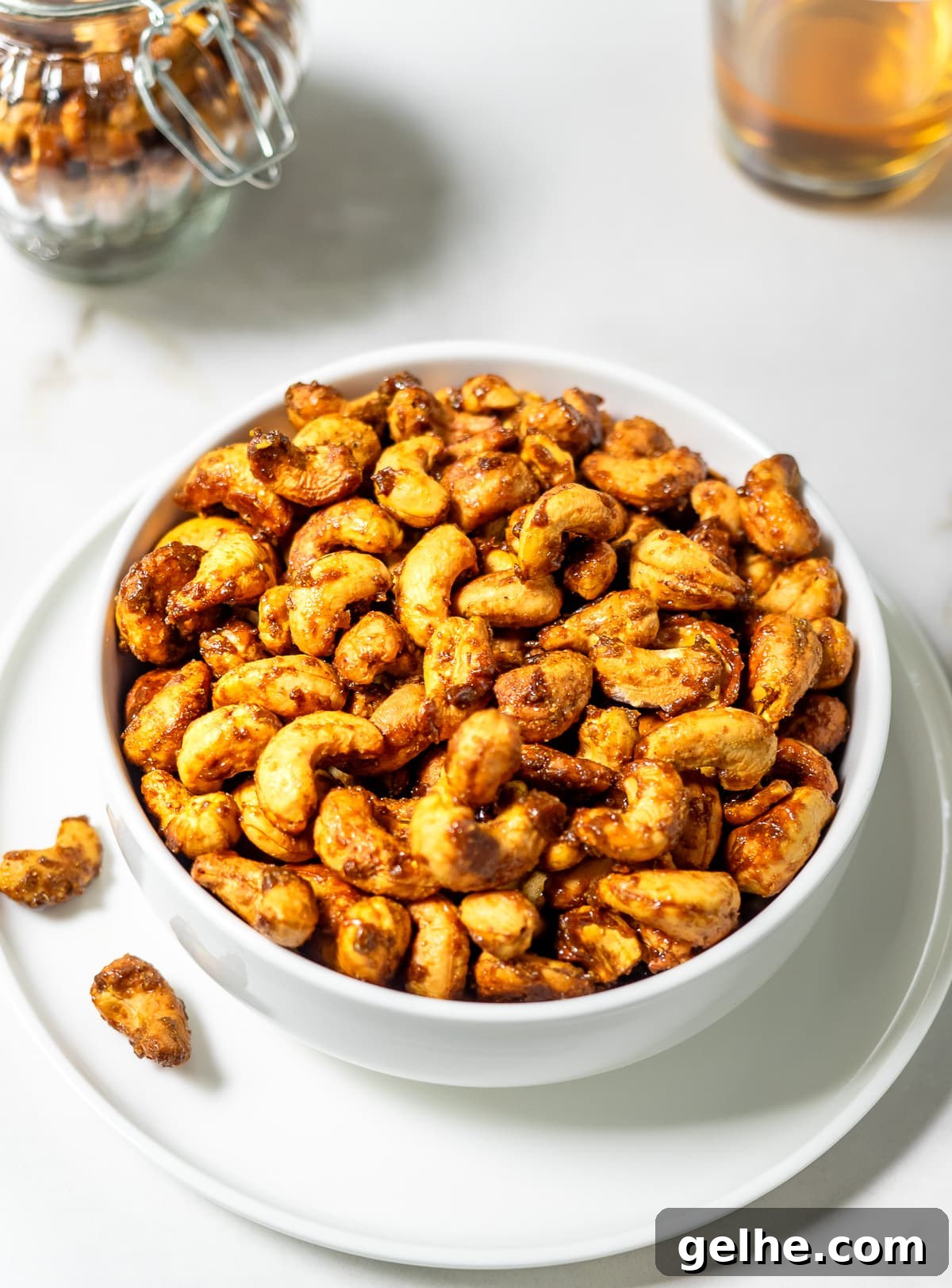 Bowl filled with roasted curry cashews.