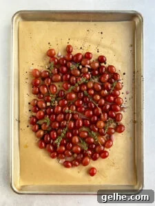 Grapes mixed with liquid and fresh thyme added.
