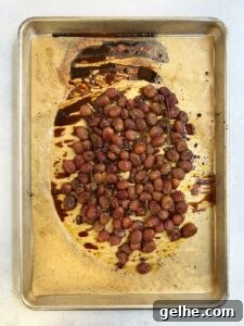 Roasted grapes on tray cooked.