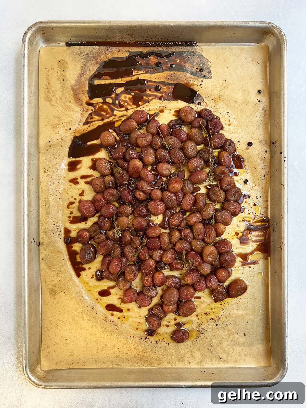 Roasted grapes on tray cooked.