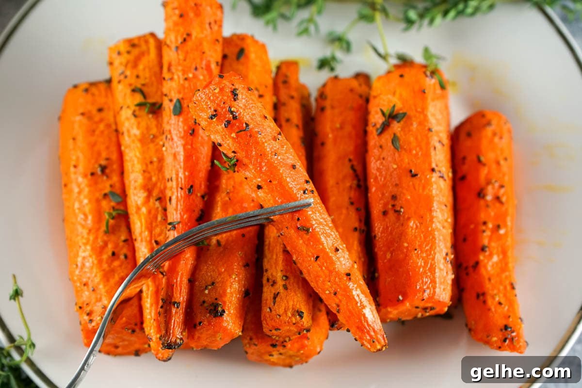 Carrots on plate and fork.