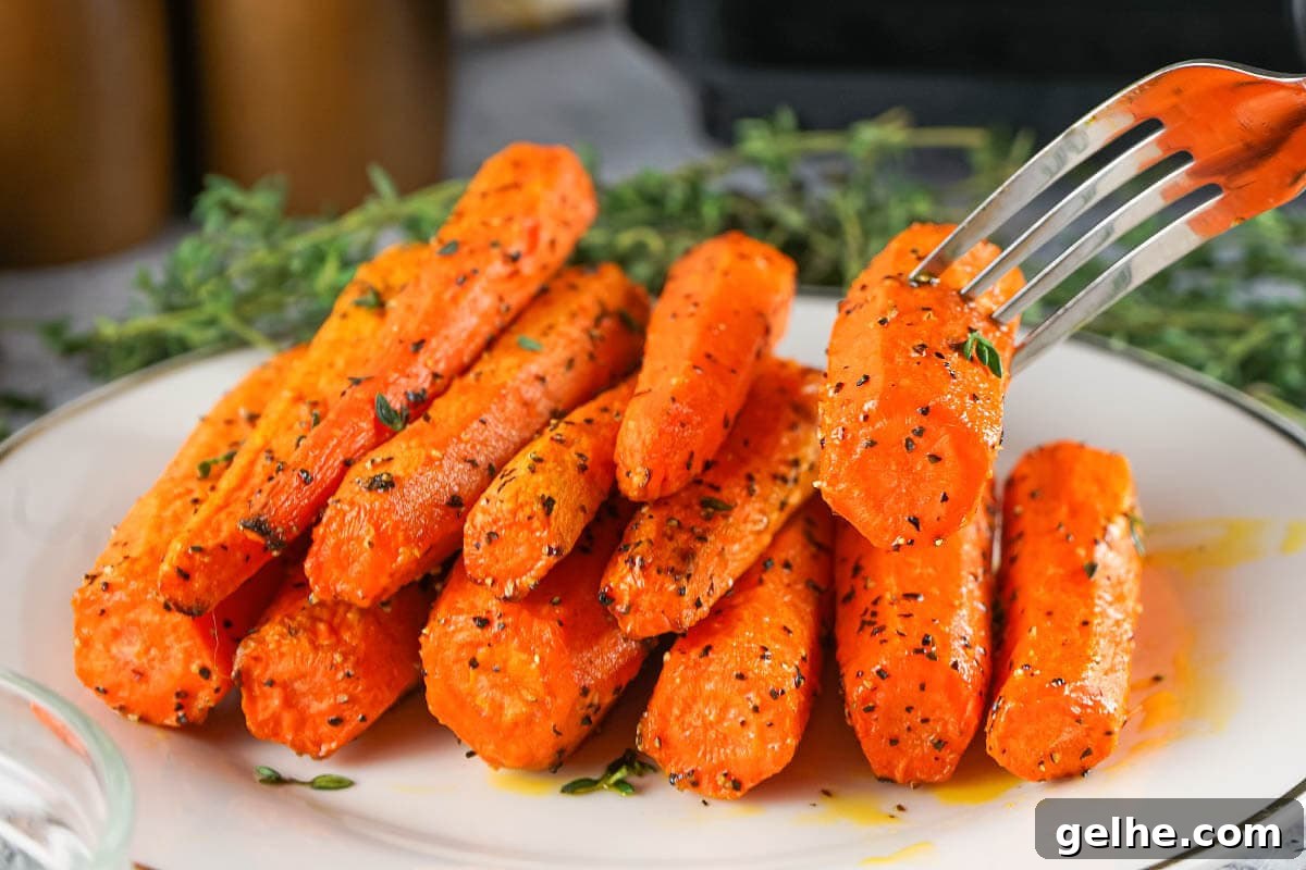 Air Fryer Carrots on plate with fork.