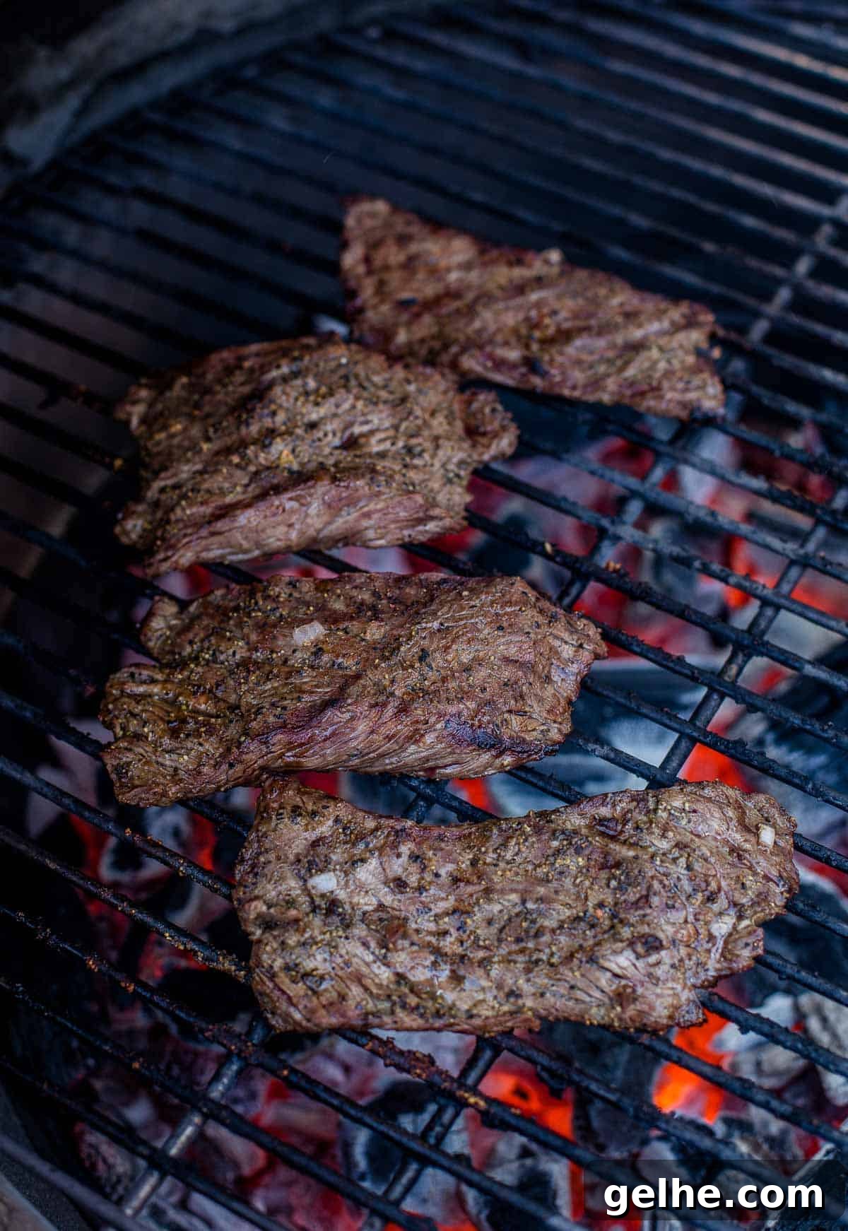 Beer Marinade Recipe for Grilled Bavette Steak 4 Bavette steak being grilled over direct heat.