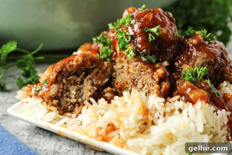 meatball sliced in half over rice
