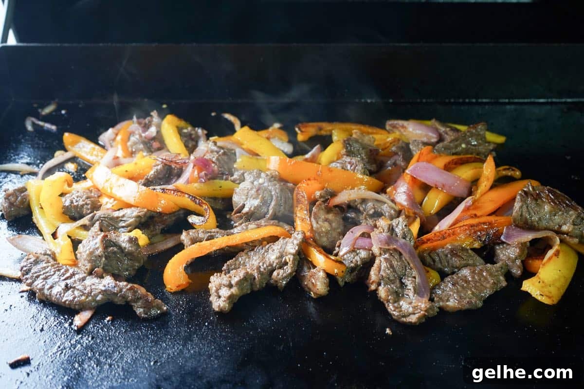 Flavor-Packed Skirt Steak Marinade for Juicy Fajitas 2 marinated Skirt Steak and veggies for fajitas cooked on the blackstone or flat top