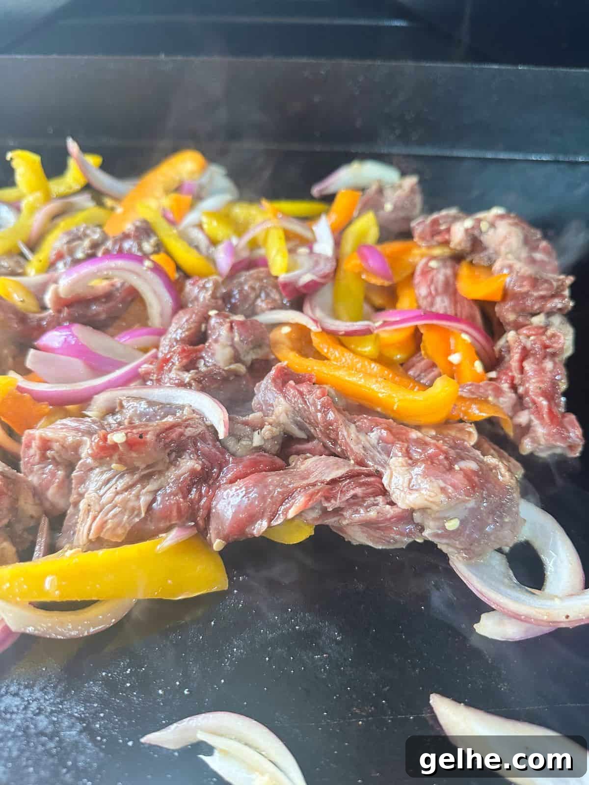 Flavor-Packed Skirt Steak Marinade for Juicy Fajitas 4 skirt steak being cooked