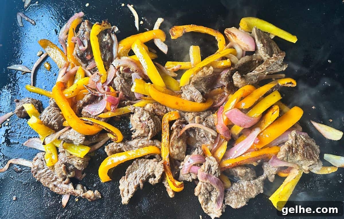 Flavor-Packed Skirt Steak Marinade for Juicy Fajitas 5 Fajita meat being cooked
