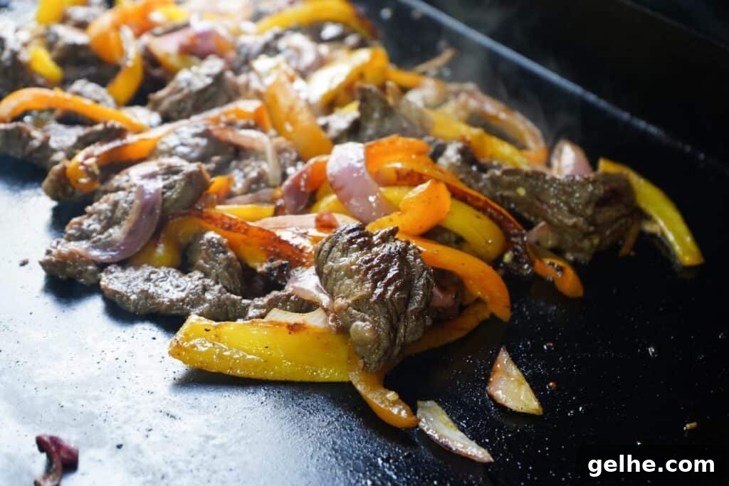 Flavor-Packed Skirt Steak Marinade for Juicy Fajitas 9 Fajita meat on flat top seared with caramelization