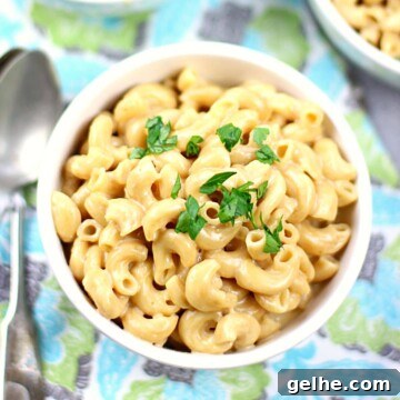 Bowl of instant pot macaroni and cheese with parsley on top.