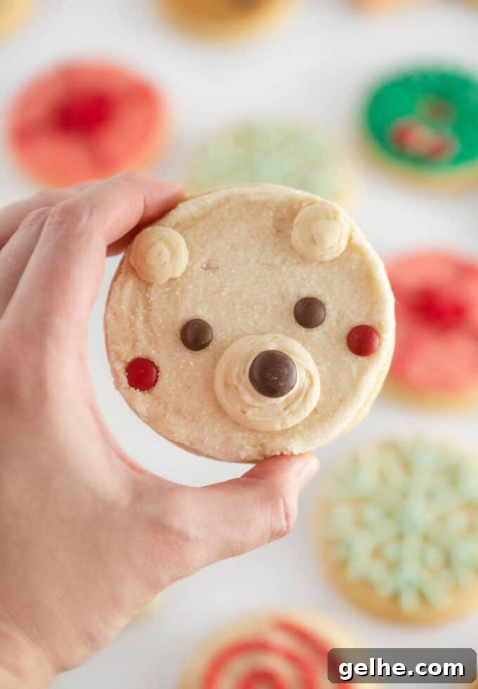 hand holding easy polar bear cookies decorated with m&m candy