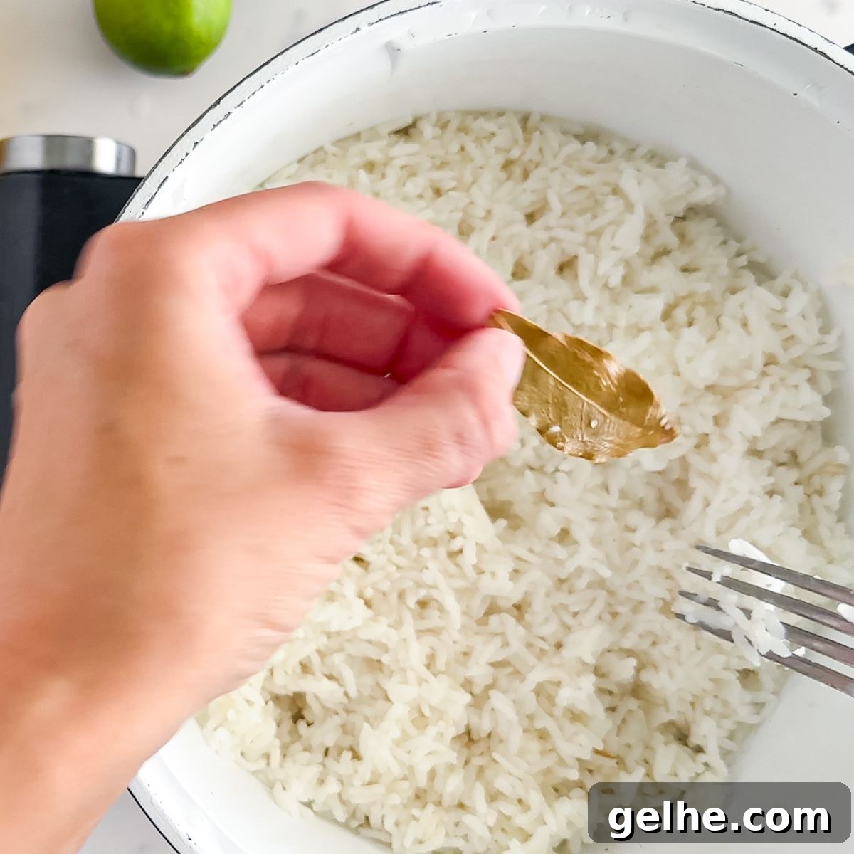 Copycat Chipotle Cilantro Lime Rice Recipe 5 Removing the bay leaf.