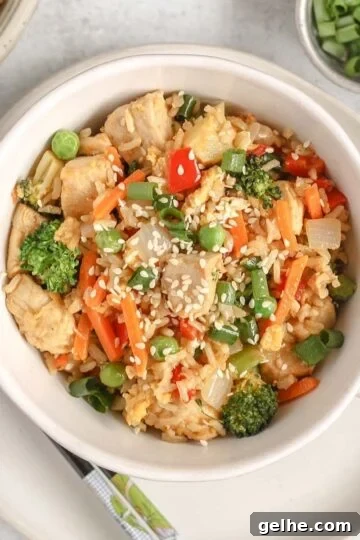 Chicken fried rice with lots of veggies in a single serve dish.