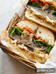 close up shot of half a portbello mushroom sandwich showing filling