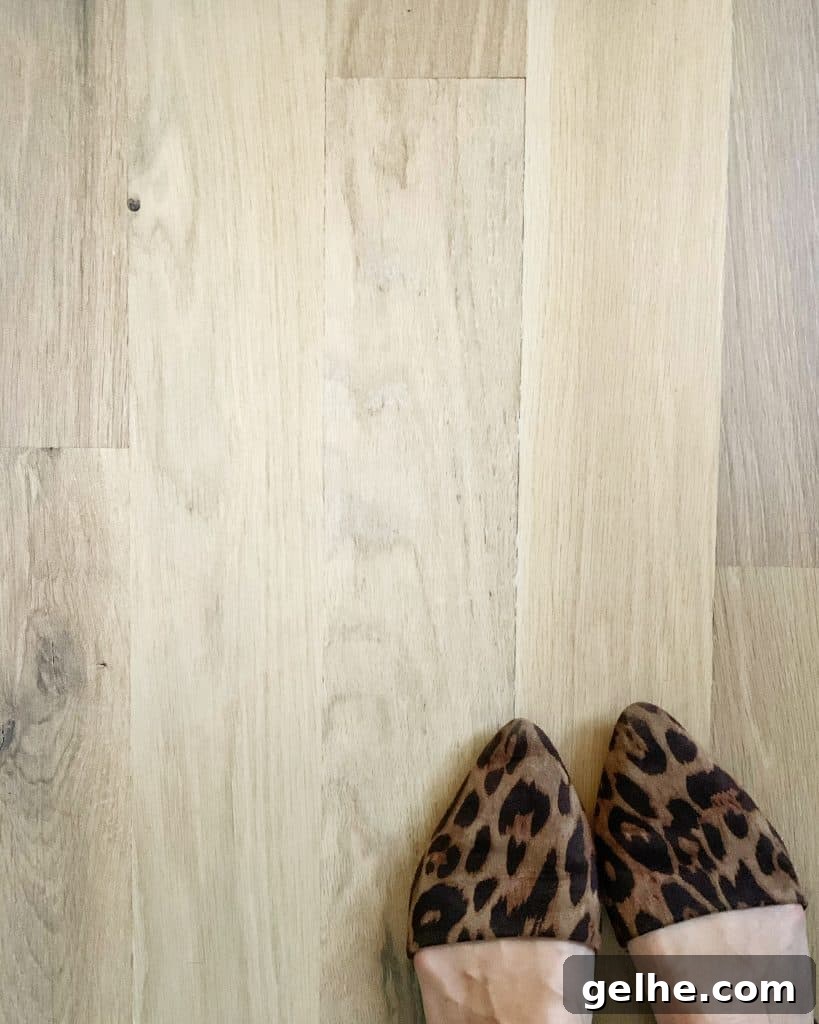 White Oak Flooring Guide: Types, Pros, Installation & Care 7 white oak hardwood floors with leopard print shoes peeking out