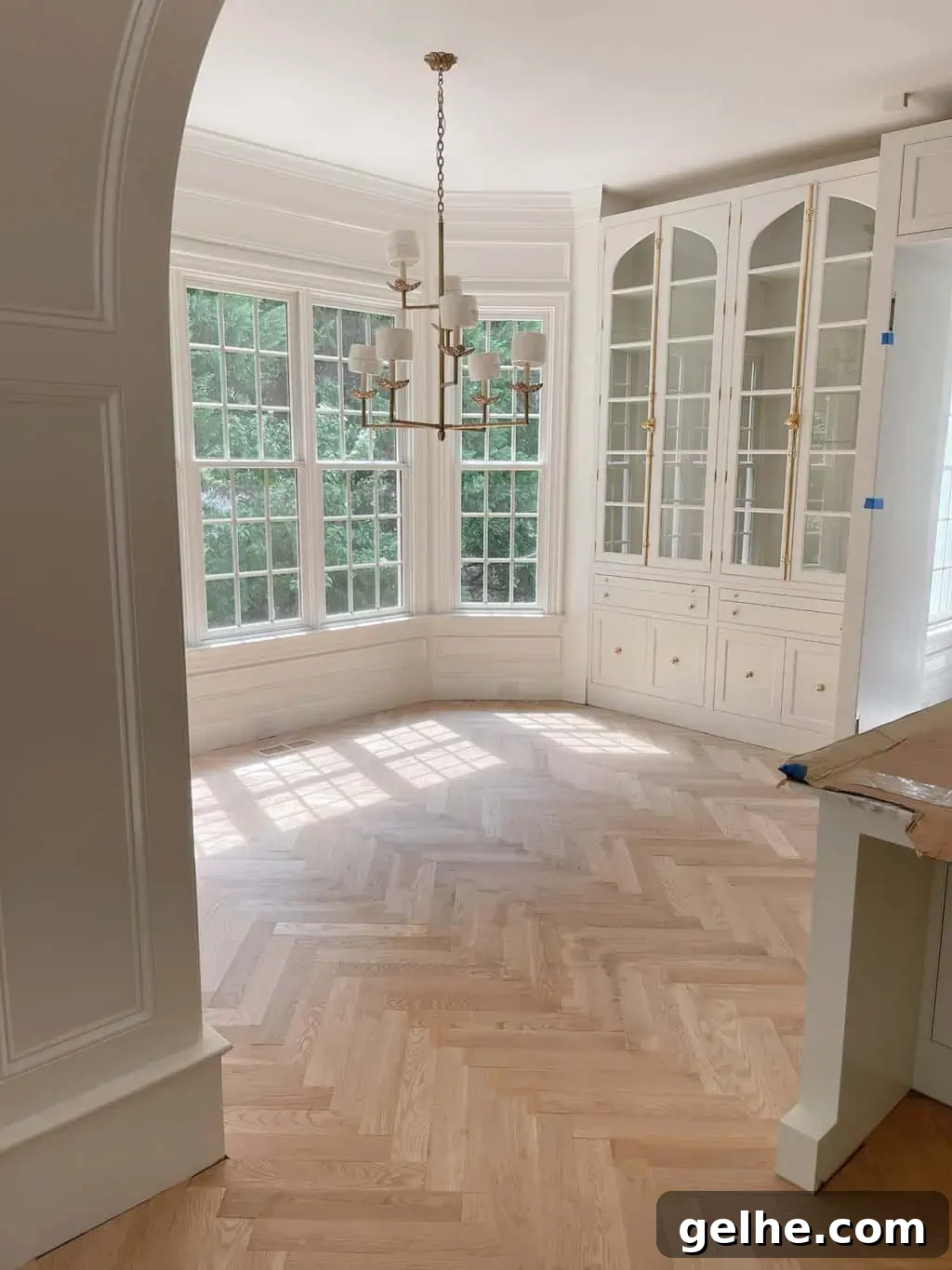White Oak Flooring Guide: Types, Pros, Installation & Care 8 white oak herringbone in a kitchen