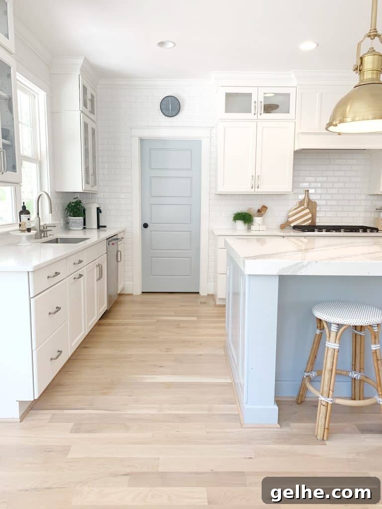 White Oak Flooring Guide: Types, Pros, Installation & Care 9 a kitchen with oak hardwood flooring