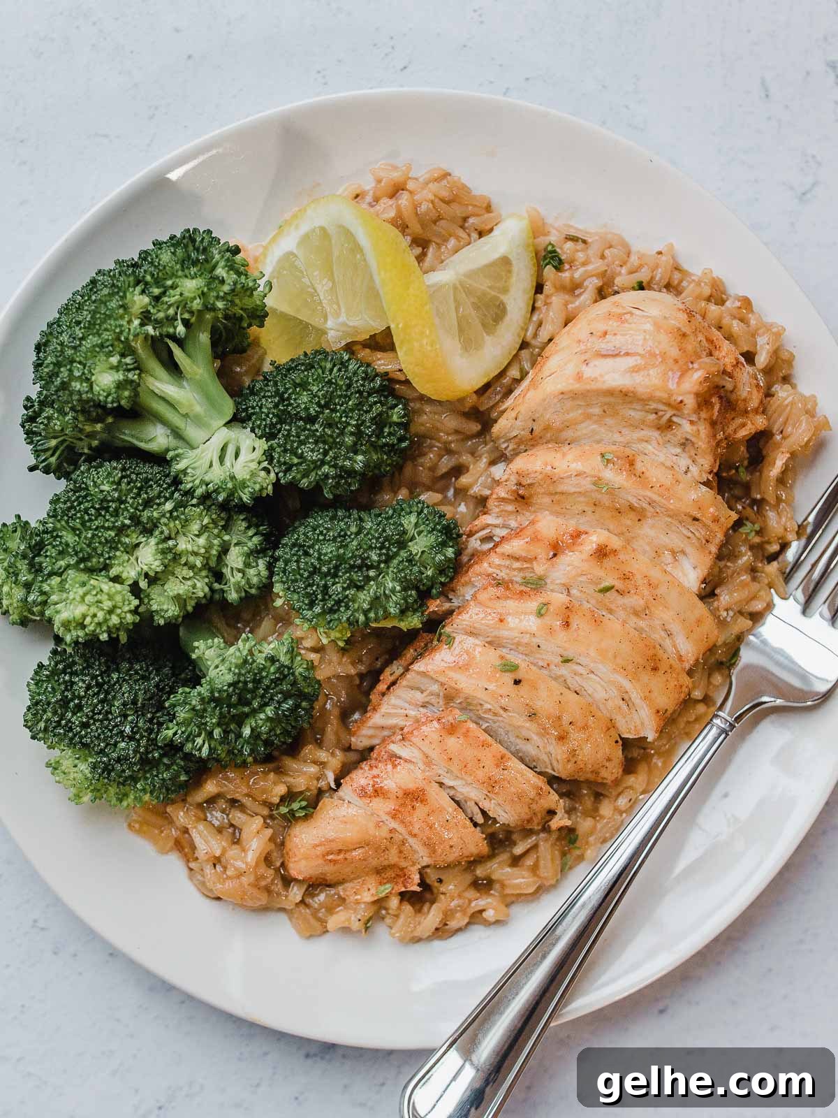 IP Lemon Herb Chicken and Rice on a plate with broccoli.