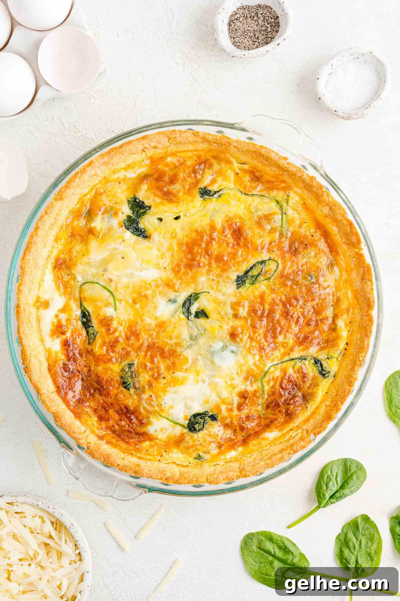 Overhead view of cooked spinach quiche.