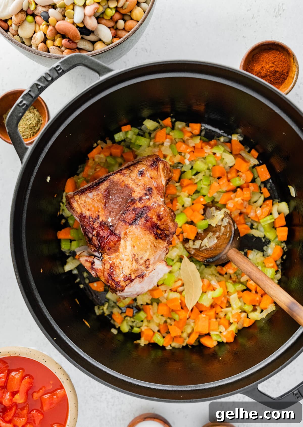 how to make 15 bean soup mix recipe with ham Step by Step: adding ham hock to the pot.