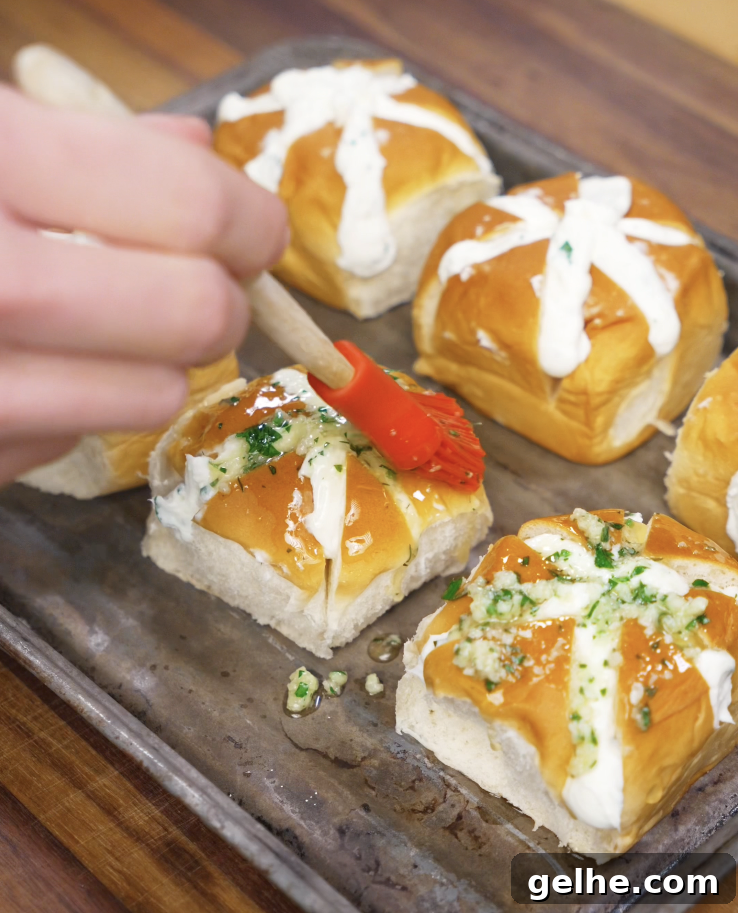 Korean Garlic Cheese Bread Recipe — Crispy, Cheesy Garlic Pull-Apart 8 Garlic butter mixture is brushed onto the filled bread rolls before baking to create a golden, flavorful crust.