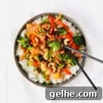 Cashew Veggie Stir-Fry is the perfect plant-based meal for meatless Monday. Loaded with veggies like bell peppers, broccoli, zucchini, and carrots. Diced fresh pineapple adds sweetness. Recipe at KathleensCravings.com