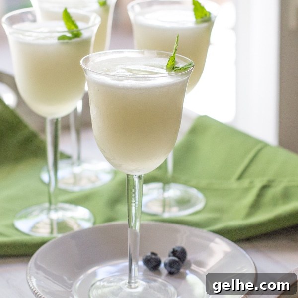 17 Delicious Vegetarian Easter Dinner Ideas for a Memorable Feast 3 Pretty glasses filled with Sgroppino and garnished with fresh mint and a few blueberries.