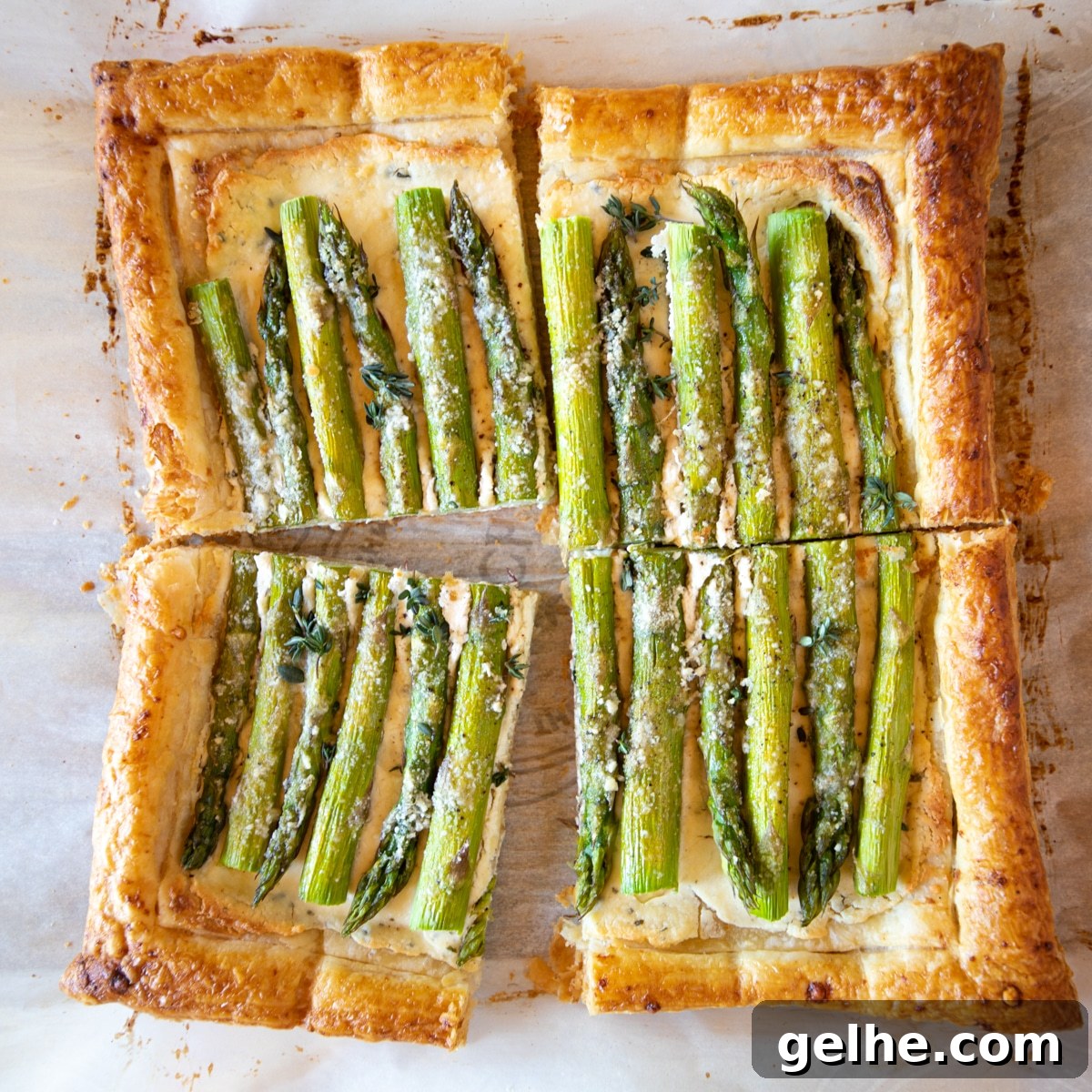 17 Delicious Vegetarian Easter Dinner Ideas for a Memorable Feast 4 Asparagus tart baked in puff pastry with cheese, sliced into 4 pieces.