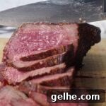 Smoked rump roast being sliced