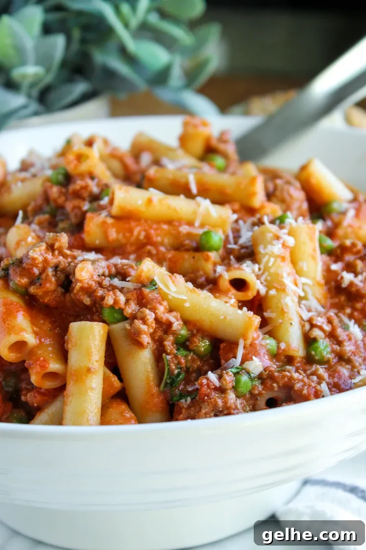 Pasta in white serving bowl.